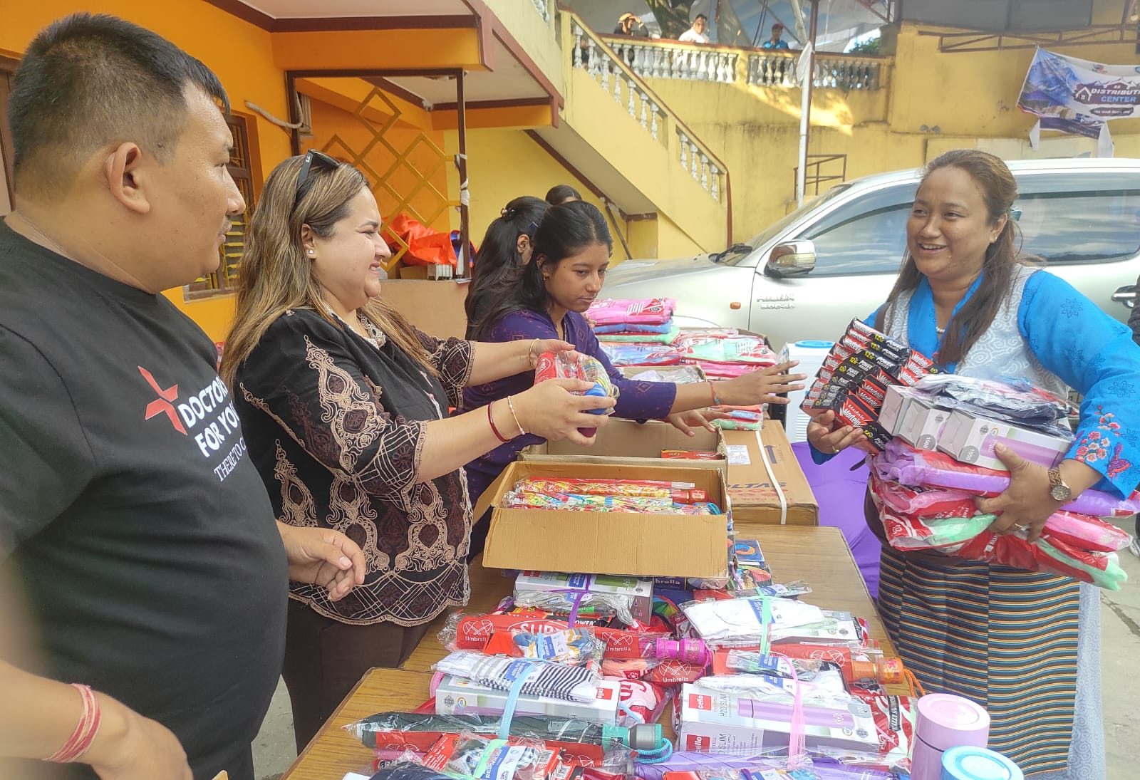 Volunteers handing out supplies