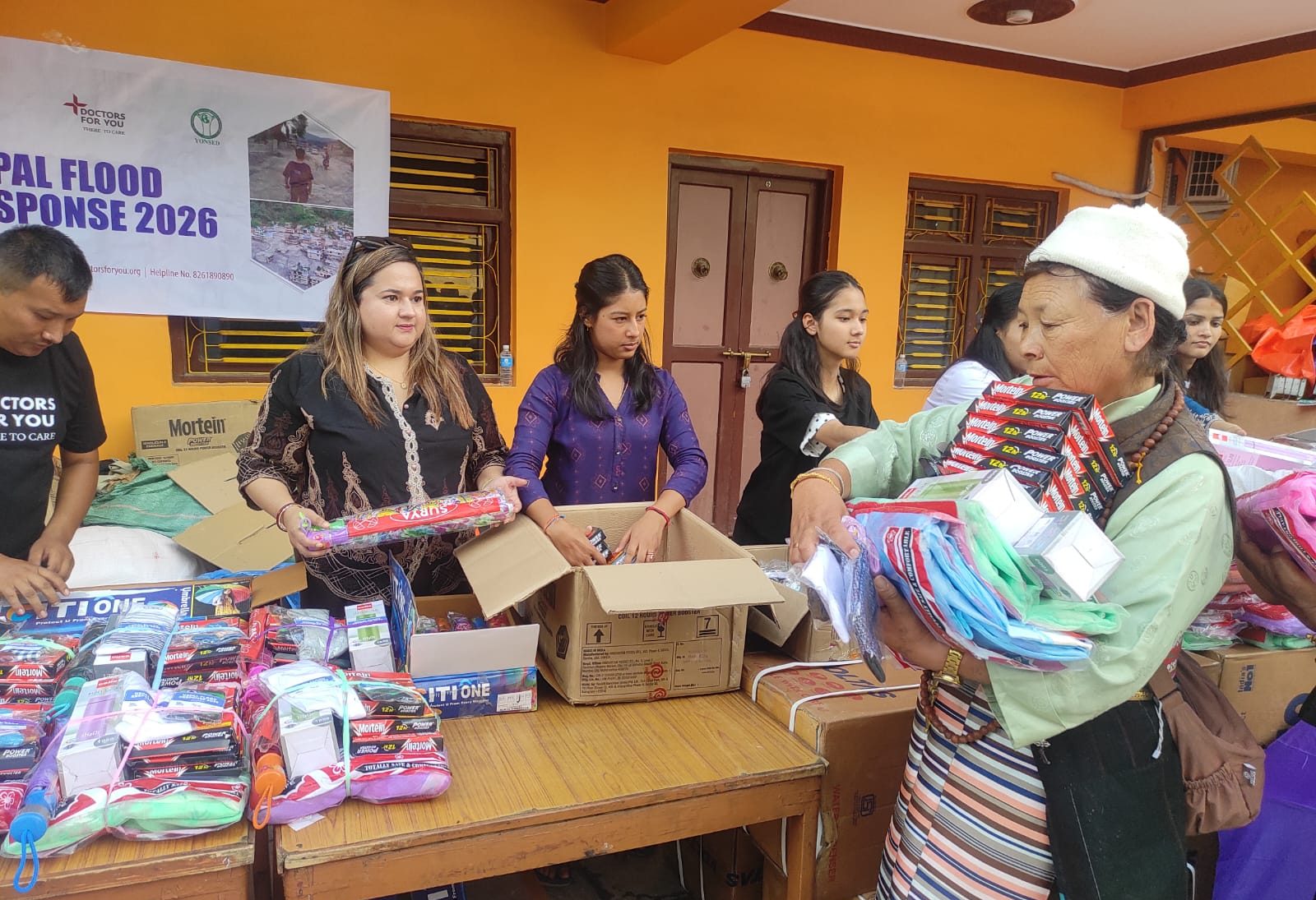 An elderly resident receiving supplies
